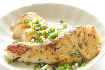 Chinese food, pan fried cod fish and scallion