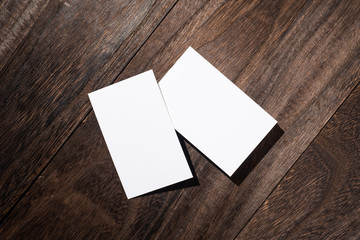 top view of white business card on wood floor