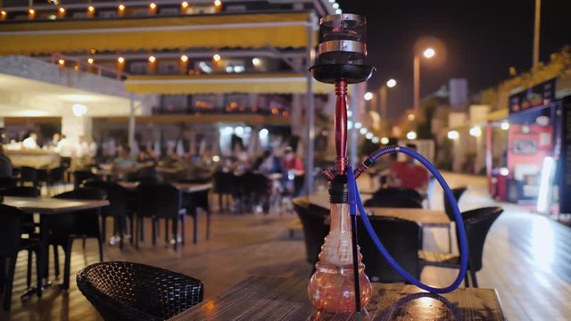 Colorful shisha standing on the table in the hookah outdoor bar. Party and relax smoking