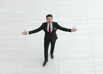 Fototapeta premium top view from afar.Businessman spreads his hands to the sides
