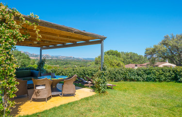 Terrace in the green and hilly landscape of Sardinia in sunlight in spring