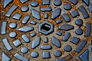 Manhole cover abstract, Paris, France 