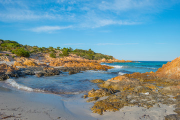 Scenic landscape of green hills and rocky mountains of the island of Sardinia in spring