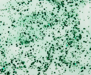 Transparent sparkle green paint stain isolated