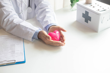 Close up of man hands with heart healthcare and medicine concept.