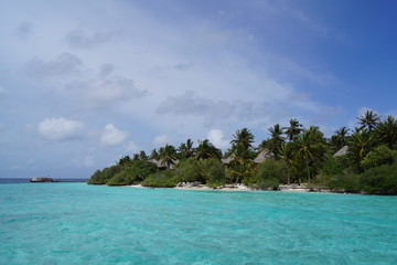 Cloudy sky over a tropical island resort on a sunny day