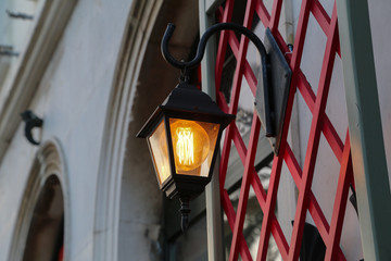 Fototapeta na wymiar Old street lamps illuminate the way for passersby