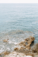  Stone walls and rocky shore. Rocks in the Bay of Budva, Montenegro.