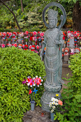 Stone statue in Zojo-ji temple park, Tokyo