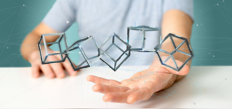 Businessman holding a 3d rendering blockchain cube isolated on a background