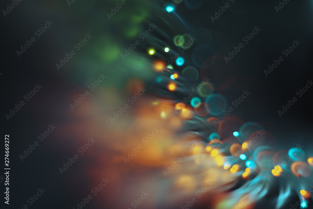 Poster beautiful colored bokeh on a dark abstract background.