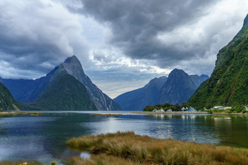 towering peaks at natural wonder milford sound, fjordland, new zealand 1