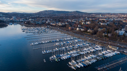 Aerial sunset view on boats in Oslofjord near the e18 highway in Oslo, Norway