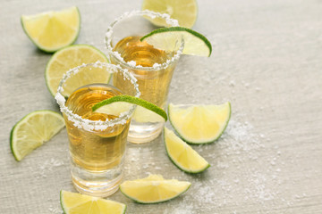 Tequila shots with sliced lime