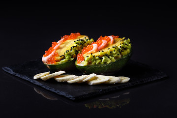 Avocado with banana caviar shrimp and canned tuna