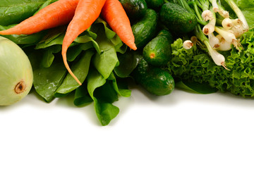 Fresh green vegetables and herbs isolated on white background. Space for text or design.
