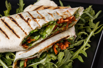 Vegetarian delicious pita with arugula and carrots