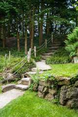 Natural stairs made of stone in a park or garden. Arrangement of nature