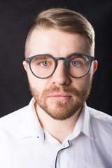 Portrait, guy and business people concept - Handsome man with glasses in white shirt looking at camera