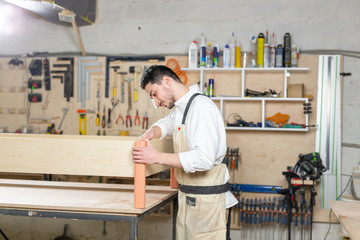 Small-Sized Companies, furniture production, business and people concept - man working at the factory