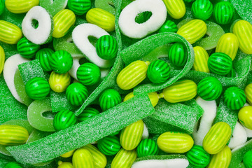 Assorted green gummy candies background. Top view. Jelly  sweets.