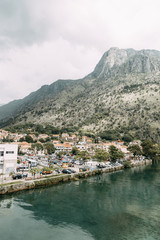 Fototapeta na wymiar Sights and views in Montenegro. Panorama of the evening Kotor from the mountain.