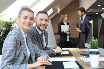 business woman with her staff, people group in background at modern bright office indoors.