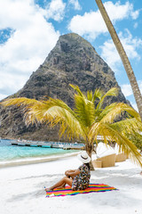 young girl on the beach of Saint Lucia, tropical Island in the Caribbean St Lucia, woman on the ebach watching the ocean on vacation, luxury hollidays