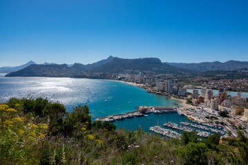 Fototapeta na wymiar Beaches and mountains of Calpe. View from the natural park of Penyal d'Ifac, Spain