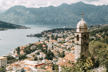  Tiled roofs in Montenegro and Europe. Panorama of the city of Kotor from the height of the mountain.