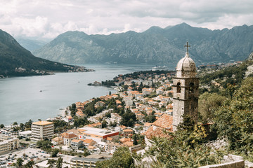  Tiled roofs in Montenegro and Europe. Panorama of the city of Kotor from the height of the mountain.