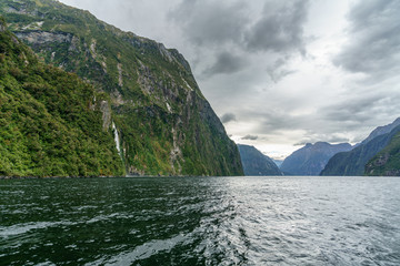 steep coast in the mountains at milford sound, fjordland, new zealand 54