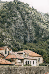 Fototapeta na wymiar Cozy corners of Montenegro. Panorama of the city of Kotor and the details of the streets.