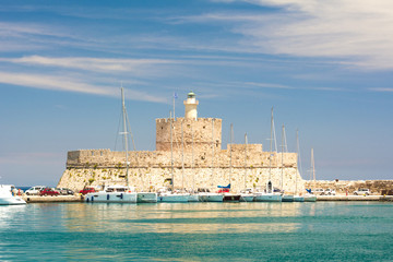 Fort of St. Nicholas with Lighthouse in Mandaki Harbor, Rhodes, Greece