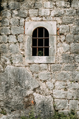 Fototapeta na wymiar Ancient ruins and stone walls. Old abandoned Church in Kotor, Montenegro.