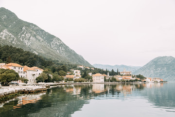 Fototapeta na wymiar Attractions and the coastal town of Kotor. Panorama of the Gulf in Montenegro, Kindness.