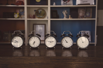 Retro alarm clocks on the table.
