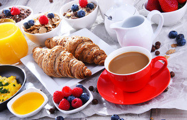 Breakfast served with coffee, juice, croissants and fruits
