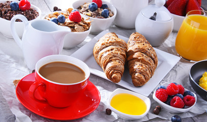 Breakfast served with coffee, juice, croissants and fruits