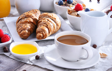 Breakfast served with coffee, juice, croissants and fruits