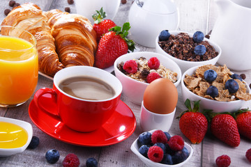 Breakfast served with coffee, juice, croissants and fruits