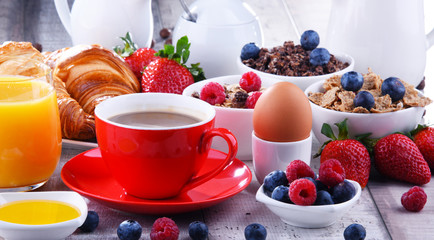 Breakfast served with coffee, juice, croissants and fruits