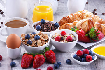 Breakfast served with coffee, juice, croissants and fruits