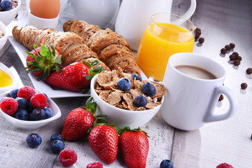 Breakfast served with coffee, juice, croissants and fruits