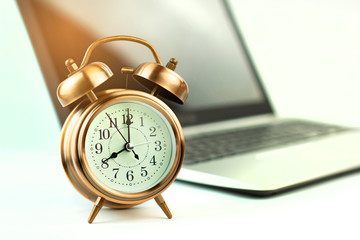 lifestyle retro clock on a computer notebook.