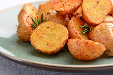 delicious baked potatoes on a rustic green plate.
