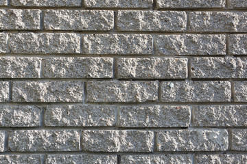 Gray brickwork used in the construction of a stone house. T