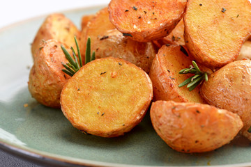 delicious baked potatoes on a rustic green plate.
