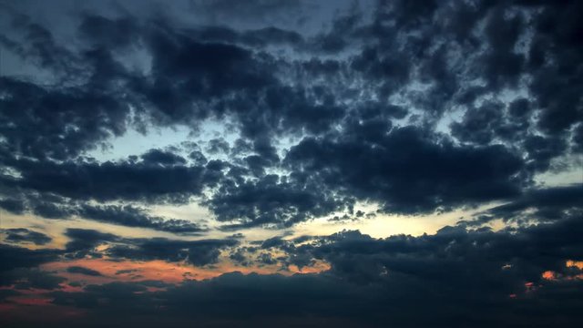 Timelapse of dark sky with clouds at sunset