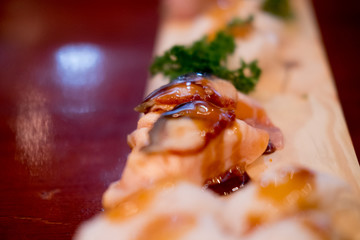 Foie Gras on top salmon sushi, close up. Japan restaurant menu